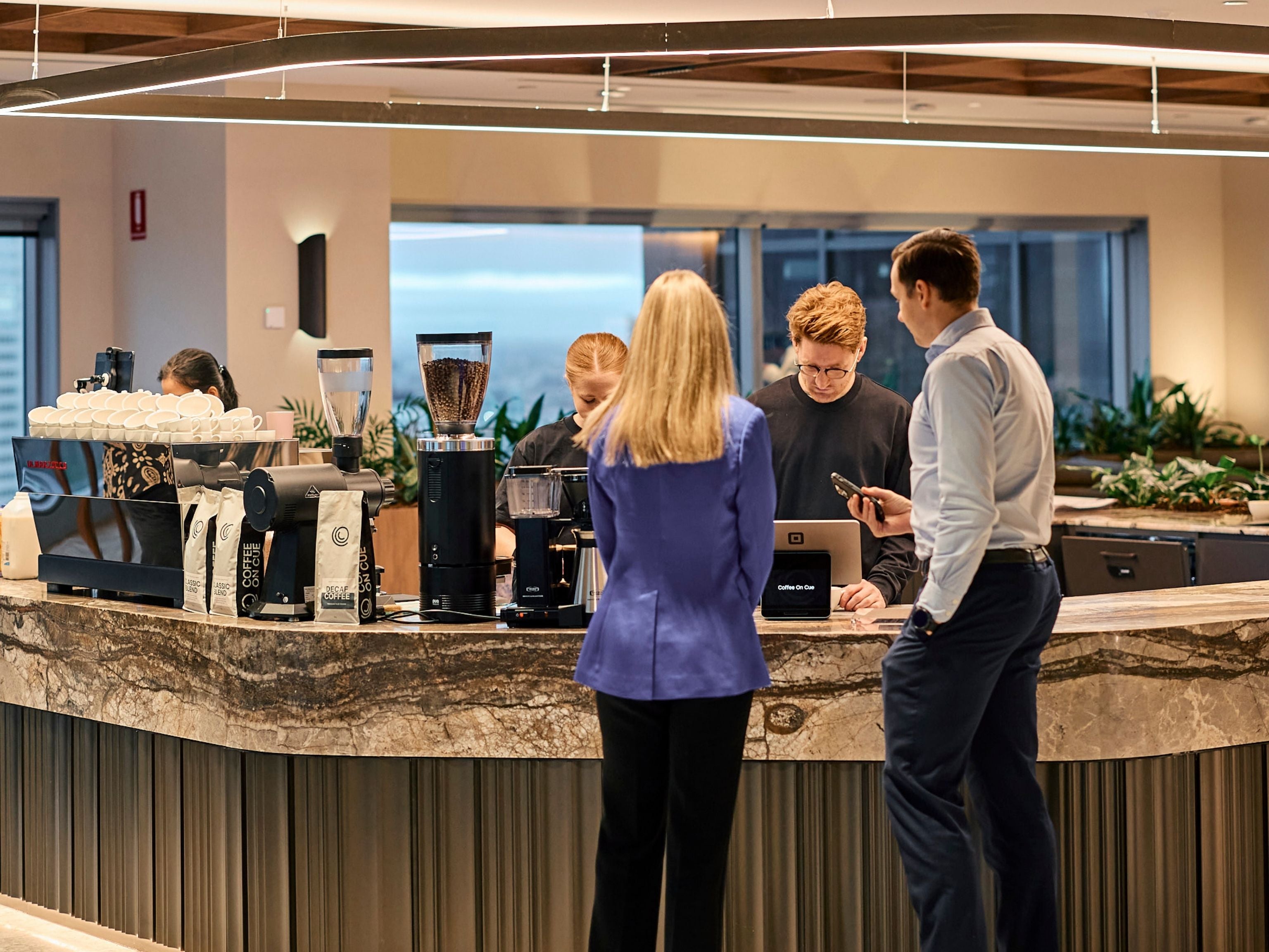 JLL team members ordering coffee at the coffee bar